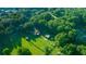 Aerial view of a home on a large lot, surrounded by lush trees and greenery at 13232 Ne 39Th Ter, Anthony, FL 32617
