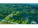 Aerial shot of property surrounded by mature trees, showcasing its vast and private setting at 13232 Ne 39Th Ter, Anthony, FL 32617