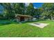 Extensive backyard features a shed, play set, and ample space for horses to graze freely at 13232 Ne 39Th Ter, Anthony, FL 32617