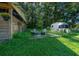 Cozy backyard featuring an Airstream trailer, fire pit, and seating area, perfect for outdoor relaxation at 13232 Ne 39Th Ter, Anthony, FL 32617