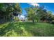 Spacious backyard with mature trees offering shade and a well-maintained lawn at 13232 Ne 39Th Ter, Anthony, FL 32617