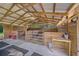 Barn interior with wood paneling, stall, and ample natural light at 13232 Ne 39Th Ter, Anthony, FL 32617