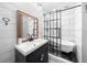 Modern bathroom features a black vanity, claw foot tub, and subway tile at 13232 Ne 39Th Ter, Anthony, FL 32617