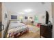 Cozy bedroom with light wood flooring, white walls, and lots of natural light at 13232 Ne 39Th Ter, Anthony, FL 32617