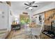 Charming dining area with white dining set adjacent to sliding glass doors leading to patio at 13232 Ne 39Th Ter, Anthony, FL 32617