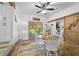 Dining area with barn door, patio access, and wood floors at 13232 Ne 39Th Ter, Anthony, FL 32617