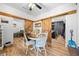 Dining area with wood table, barn doors, and lots of natural light at 13232 Ne 39Th Ter, Anthony, FL 32617