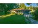 Charming ranch-style home features a lush green lawn and an attached two-car garage at 13232 Ne 39Th Ter, Anthony, FL 32617