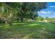 A vast front yard adorned with mature trees and lush green grass at 13232 Ne 39Th Ter, Anthony, FL 32617