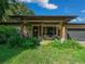 Charming front porch featuring inviting seating, potted plants, and a welcoming door at 13232 Ne 39Th Ter, Anthony, FL 32617