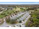 An aerial view of a residential community with manicured lawns, mature trees, and a golf course at 13618 Sw 111Th Cir, Dunnellon, FL 34432
