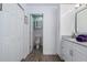 Bright bathroom featuring stylish decor, updated white cabinets and a view of the toilet and shower at 13618 Sw 111Th Cir, Dunnellon, FL 34432
