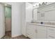 Bathroom features dual sinks, lots of counter space, and a large mirror providing a practical space for personal care at 13618 Sw 111Th Cir, Dunnellon, FL 34432