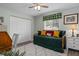Bright bedroom featuring stylish decor, ceiling fan, hardwood flooring, and closet with double doors at 13618 Sw 111Th Cir, Dunnellon, FL 34432