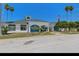 The Spruce Creek Preserve Clubhouse features lush landscaping and ample parking at 13618 Sw 111Th Cir, Dunnellon, FL 34432
