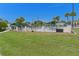 Community pool area featuring a large pool, poolside seating, and well-maintained landscaping at 13618 Sw 111Th Cir, Dunnellon, FL 34432