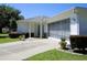 This inviting home has a brick entryway, screened garage and a well-manicured lawn at 13618 Sw 111Th Cir, Dunnellon, FL 34432