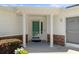 Inviting front porch with decorative columns and well-maintained landscaping creates great curb appeal at 13618 Sw 111Th Cir, Dunnellon, FL 34432