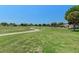Scenic view of the community golf course under a blue sky at 13618 Sw 111Th Cir, Dunnellon, FL 34432