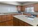 Spacious kitchen with granite countertops, wood cabinets, and stainless steel dishwasher at 13618 Sw 111Th Cir, Dunnellon, FL 34432