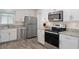 Well-equipped kitchen featuring stainless steel appliances, granite countertops and lots of cabinet space at 13618 Sw 111Th Cir, Dunnellon, FL 34432