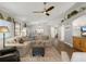 Bright living room featuring a fan and hardwood floors, creating a welcoming atmosphere at 13618 Sw 111Th Cir, Dunnellon, FL 34432