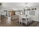 Spacious living area with hardwood flooring, dining area, and abundant natural light at 13618 Sw 111Th Cir, Dunnellon, FL 34432