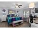 Bright main bedroom featuring stylish decor, ceiling fan, and hardwood flooring for a luxurious retreat at 13618 Sw 111Th Cir, Dunnellon, FL 34432