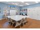 Meeting room with ample table space, shelving, and blue painted walls at 13618 Sw 111Th Cir, Dunnellon, FL 34432