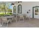 Outdoor patio area with tables and chairs, perfect for dining and relaxing at 13618 Sw 111Th Cir, Dunnellon, FL 34432