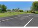Recreational area with basketball court, park bench, grassy field, and nearby homes at 13618 Sw 111Th Cir, Dunnellon, FL 34432