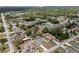 Aerial view of home situated on a tree-lined street in a well-established neighborhood at 14118 Sw 32Nd Terrace Rd, Ocala, FL 34473