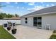 The backyard has a concrete patio and a white vinyl fence, offering space for outdoor living and entertaining at 14118 Sw 32Nd Terrace Rd, Ocala, FL 34473