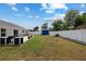 Enjoy this spacious backyard with a patio, blue shed, lush lawn, and a full privacy fence, perfect for entertaining at 14118 Sw 32Nd Terrace Rd, Ocala, FL 34473