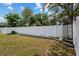 Landscaped backyard featuring a white fence border with decorative rock, plants, and solar lighting for serene evenings at 14118 Sw 32Nd Terrace Rd, Ocala, FL 34473