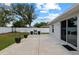 A lovely backyard features a patio, a grill and bar setup, and a view of mature trees at 14118 Sw 32Nd Terrace Rd, Ocala, FL 34473