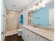 Bright bathroom with a walk-in shower, neutral tile, and vanity at 14118 Sw 32Nd Terrace Rd, Ocala, FL 34473