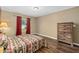 Neutral-toned bedroom featuring wood flooring and a window at 14118 Sw 32Nd Terrace Rd, Ocala, FL 34473