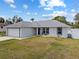 Charming single-story home with a well-manicured lawn and an attached garage with driveway at 14118 Sw 32Nd Terrace Rd, Ocala, FL 34473