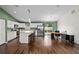 Well-lit kitchen with white cabinets, stainless steel appliances, and a large island with bar seating at 14118 Sw 32Nd Terrace Rd, Ocala, FL 34473