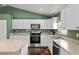 Spacious kitchen with an island, stainless steel appliances, and ample counter space at 14118 Sw 32Nd Terrace Rd, Ocala, FL 34473