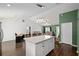 Open floor plan with a kitchen island, dining area, and living room at 14118 Sw 32Nd Terrace Rd, Ocala, FL 34473