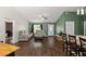 Cozy living area with comfortable seating, a bright window, and seamless access to the kitchen at 14118 Sw 32Nd Terrace Rd, Ocala, FL 34473