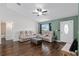 Cozy living room with hardwood floors, a ceiling fan, and modern, comfortable seating at 14118 Sw 32Nd Terrace Rd, Ocala, FL 34473