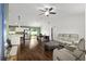 Open-concept living room with modern seating, hardwood floors, and a combined kitchen at 14118 Sw 32Nd Terrace Rd, Ocala, FL 34473