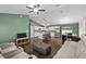Open-concept living area flows to the kitchen, featuring modern furniture and ample natural light at 14118 Sw 32Nd Terrace Rd, Ocala, FL 34473