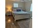 This bedroom is freshly painted with wood floor and has a large window for lots of beautiful, natural light at 14121 Nw Highway 225, Reddick, FL 32686