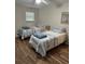 This bedroom has two twin beds, wood floor and a large window for lots of beautiful, natural light at 14121 Nw Highway 225, Reddick, FL 32686