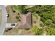 Birds eye view of a single story home with a brown roof and a black car in the driveway at 15920 Sw 49Th Court Rd, Ocala, FL 34473