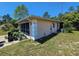 Exterior angle showcasing a screened-in garage in a backyard setting at 15920 Sw 49Th Court Rd, Ocala, FL 34473